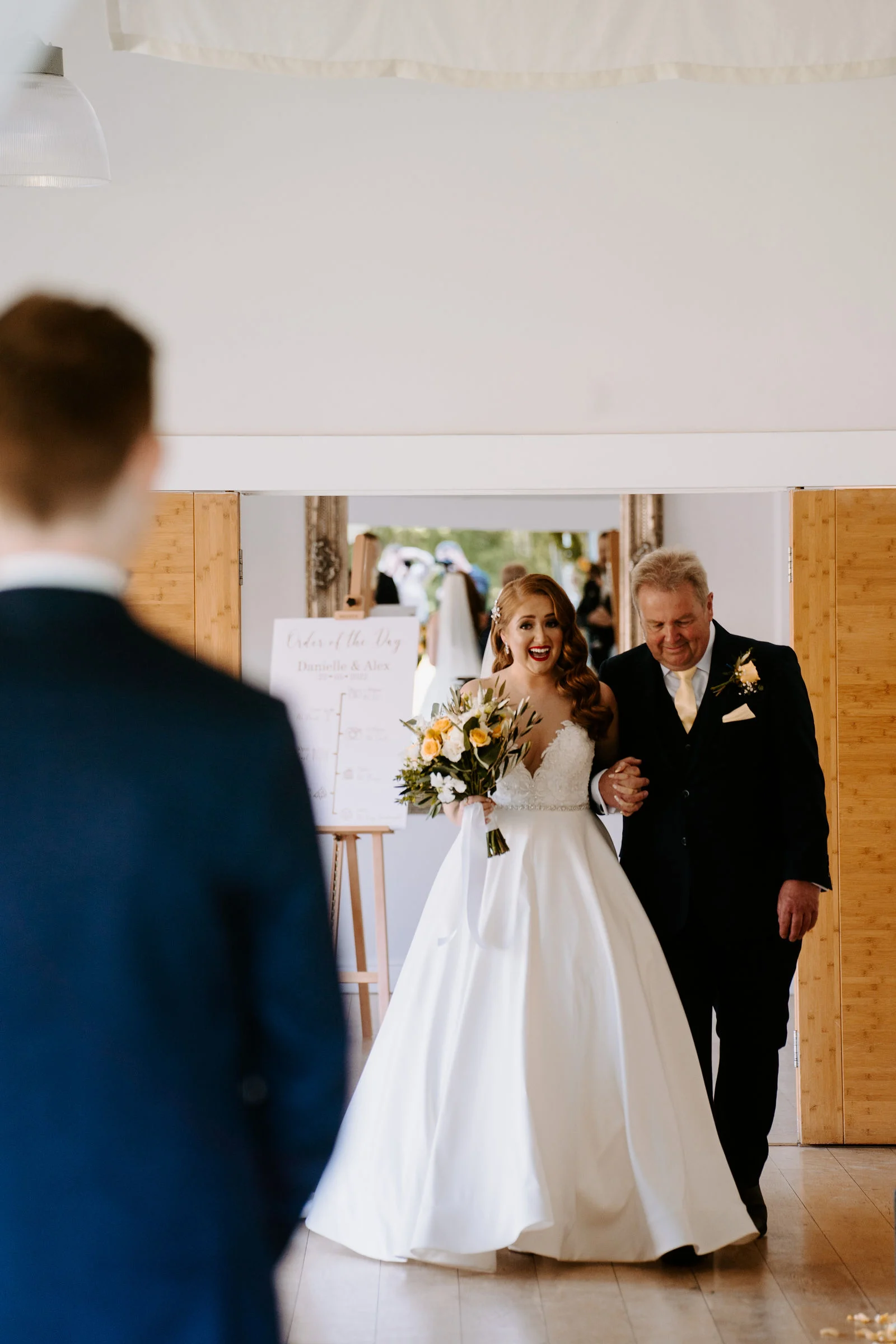 Danielle smiling during morning bridal preparations in the boutique suites at Wasing Park