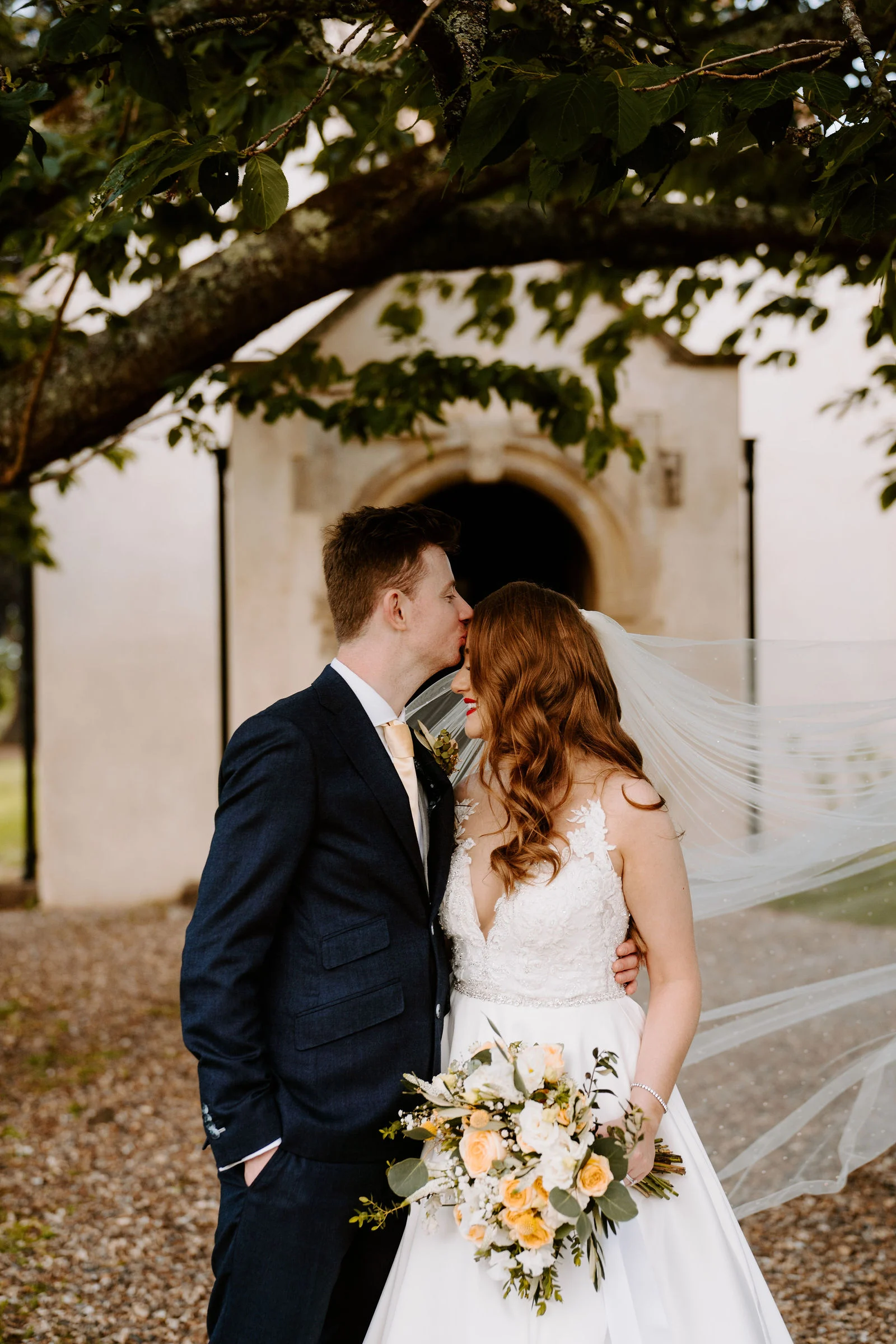 Danielle and Alex exchanging vows during their ceremony at Wasing Park in Berkshire