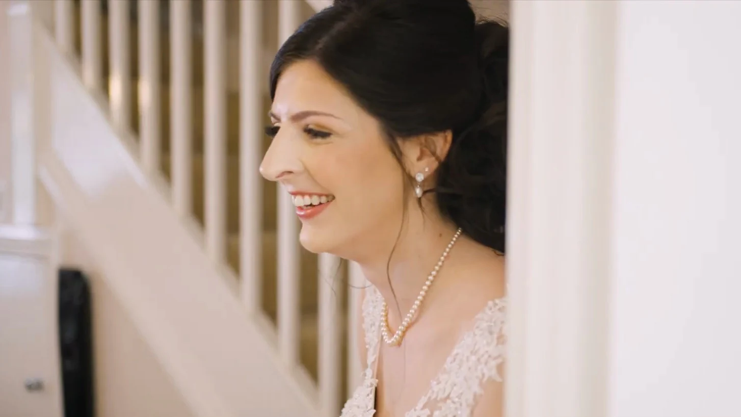 Still from Kelly & Luke’s wedding highlight at Donington Park Farmhouse