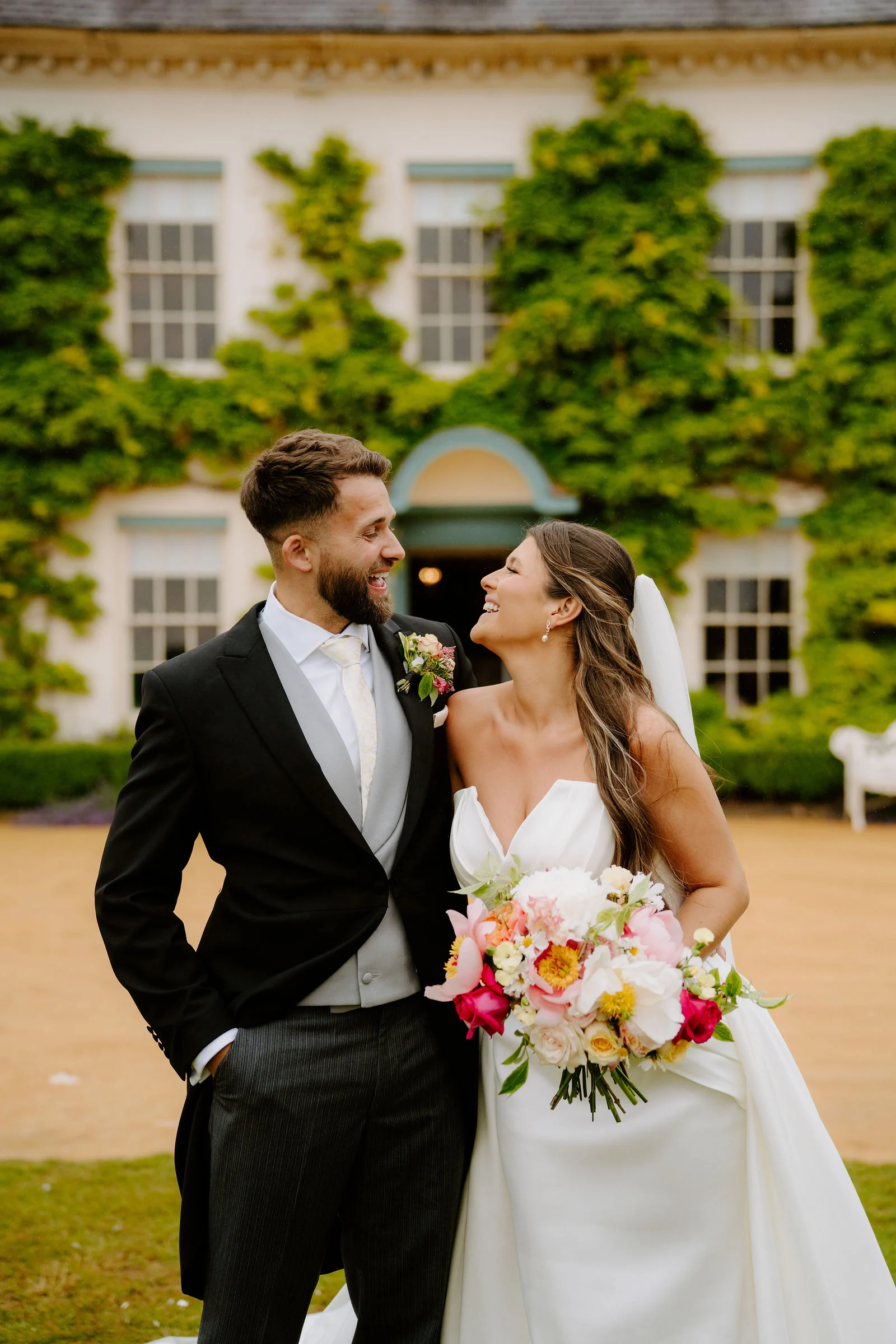 Couple embracing in the evening coastal light at Gileston Manor