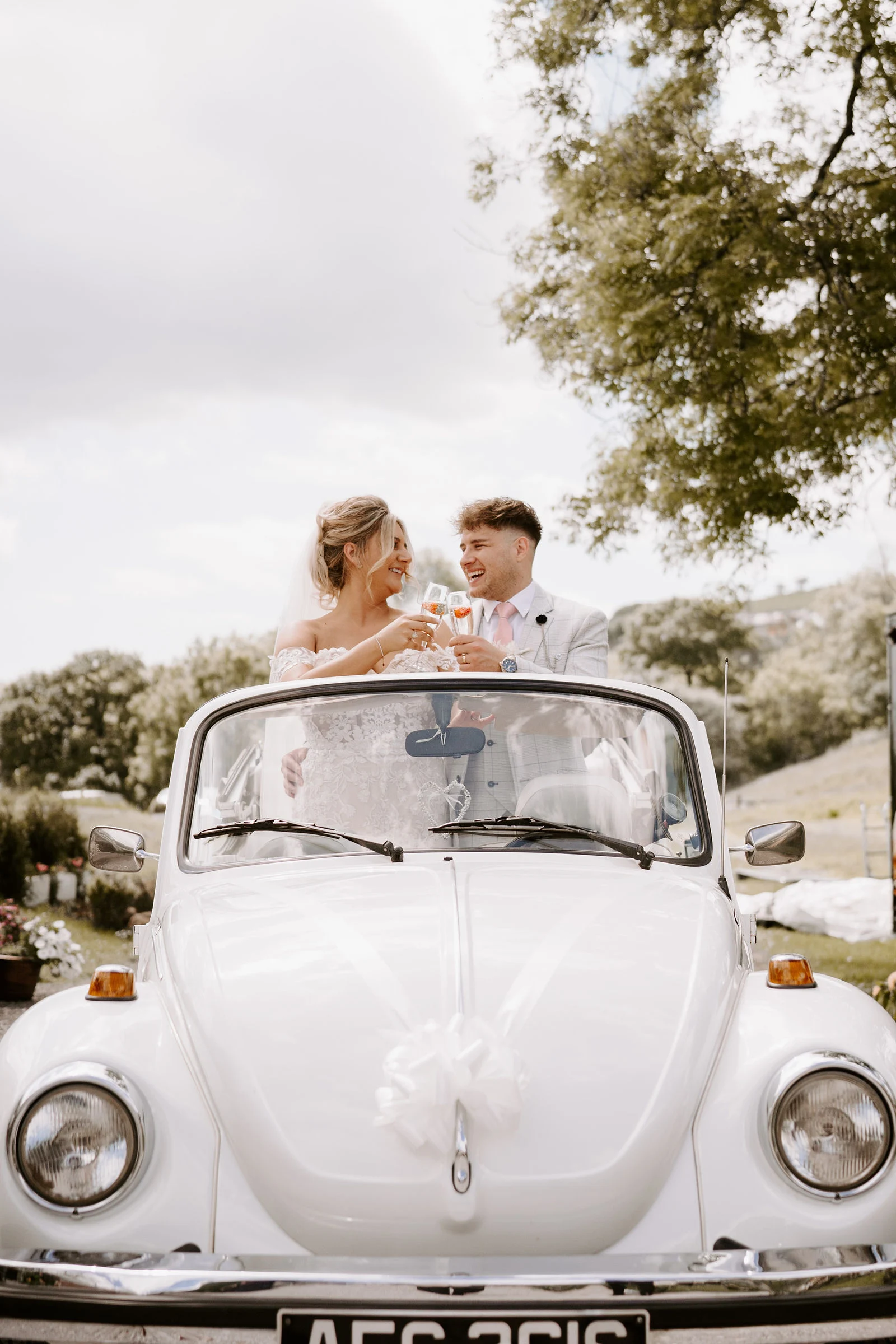 Romantic bride and groom portrait under the weeping willows at Lakeside Venue