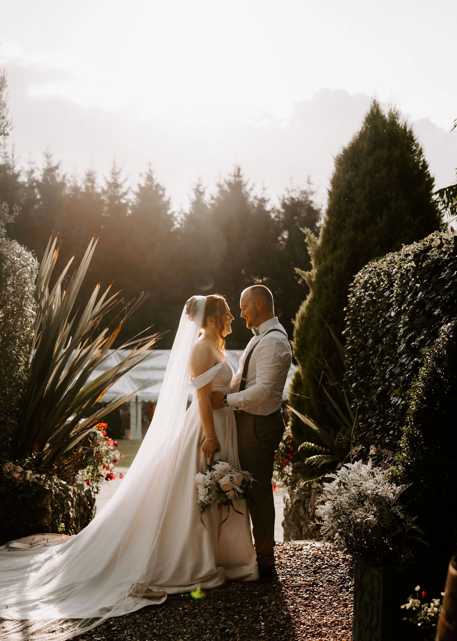 Romantic bride and groom portrait in the secluded garden grounds of The Old Rectory Clinic in Pencoed