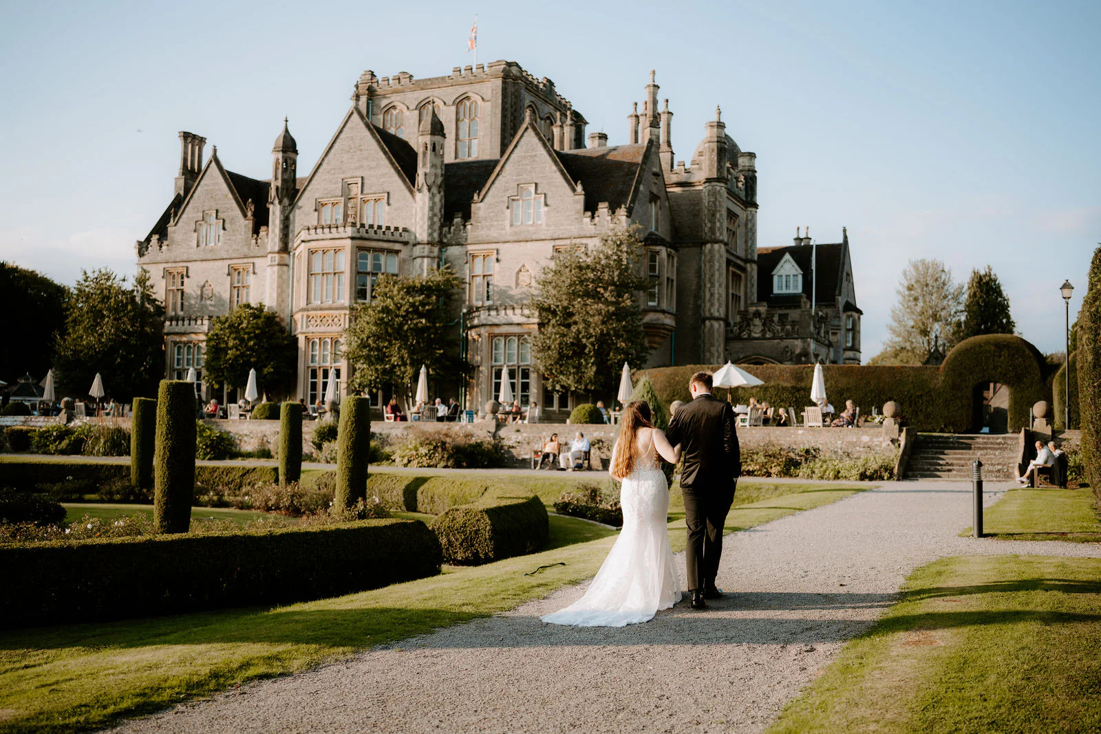 Romantic wedding couple portrait stroll in the historic grounds at De Vere Tortworth Court near Bristol