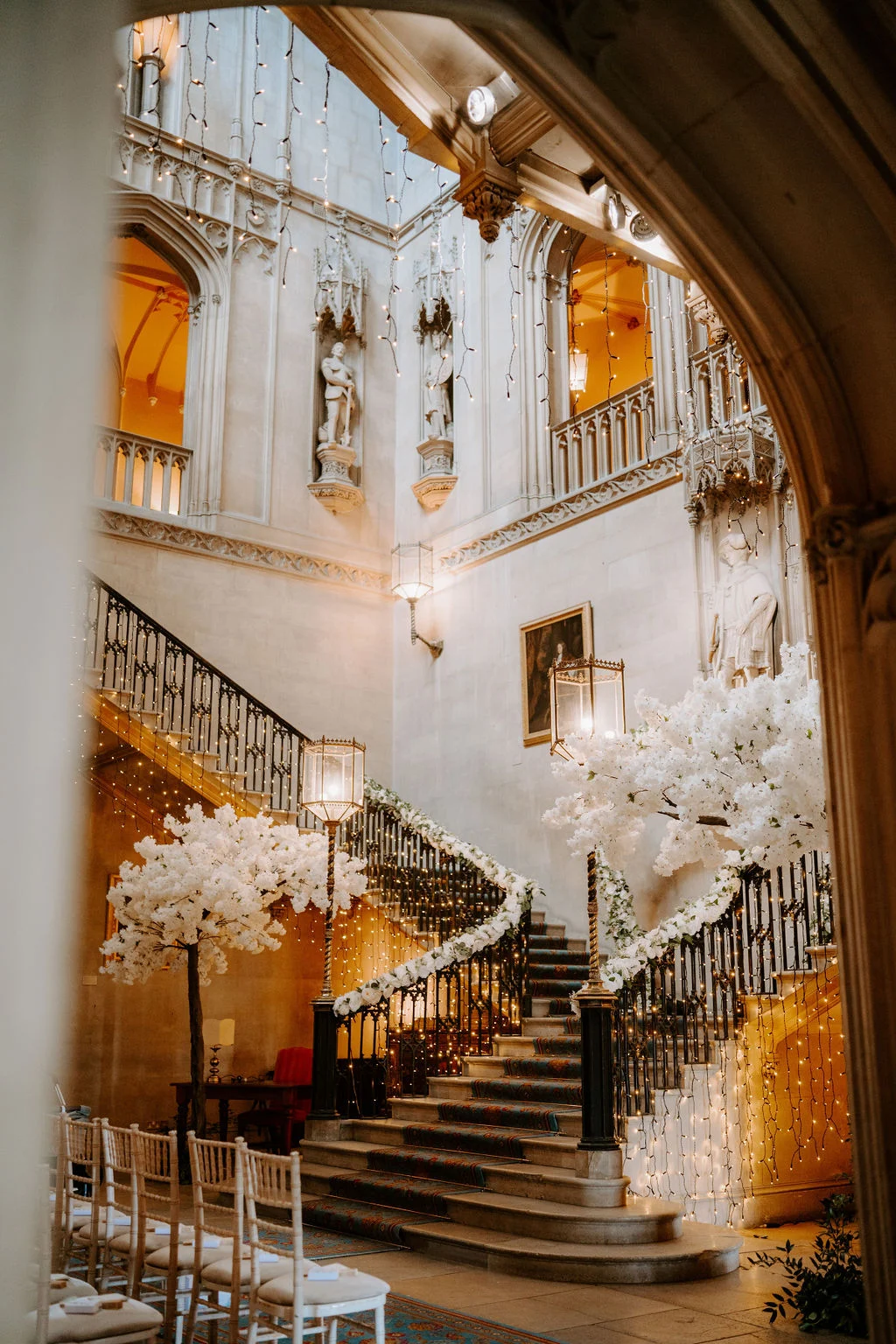 Flower arrangements beside the grand staircase at Ashridge House