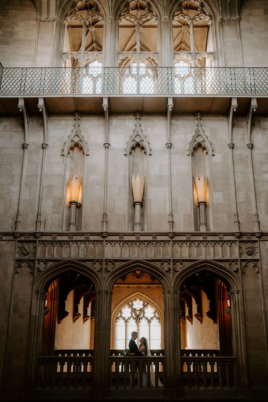The tall Gothic interior at Ashridge House with candles lit