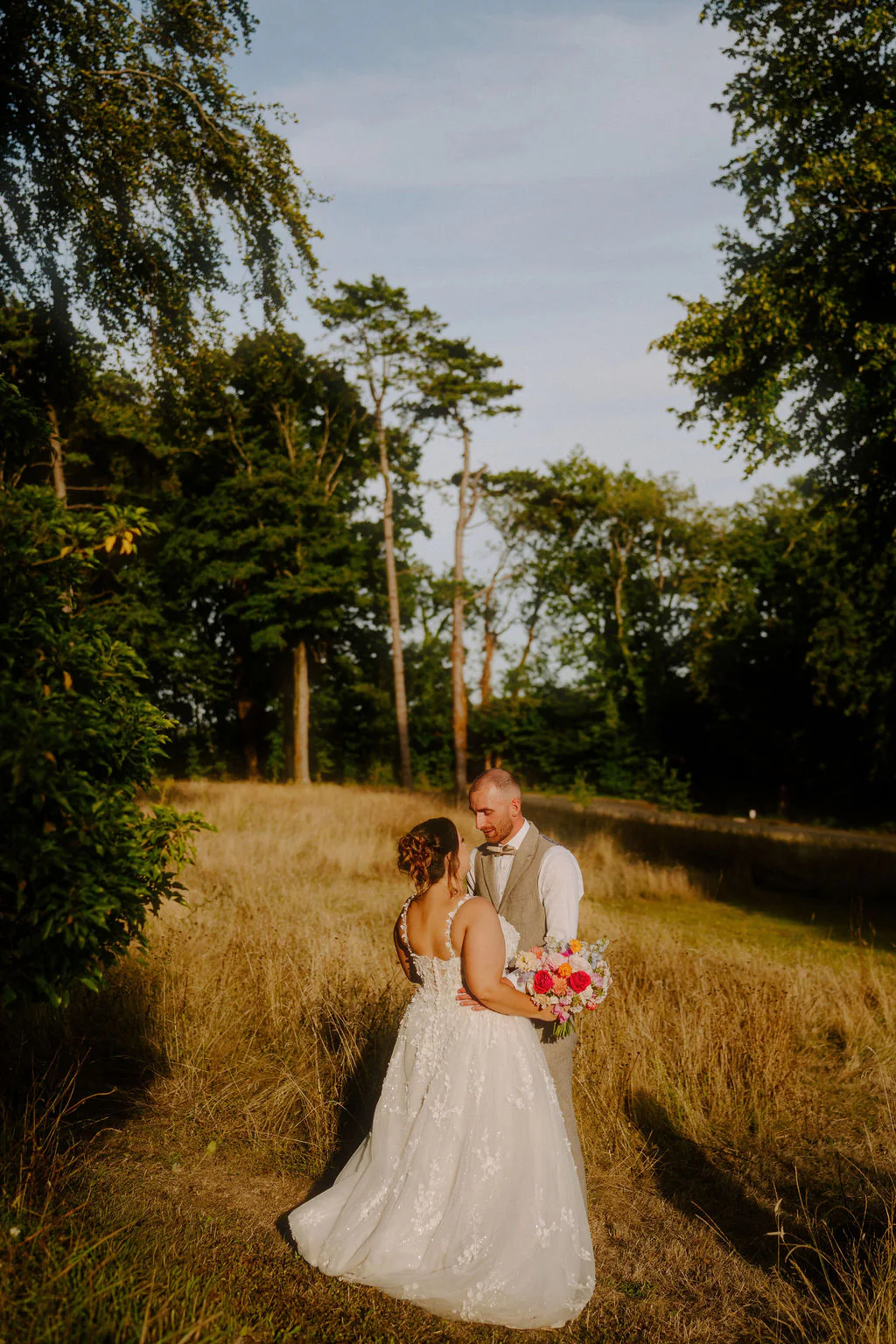 Laura and Jordan romantic evening portrait on the lawn at Coed-Y-Mwstwr Hotel