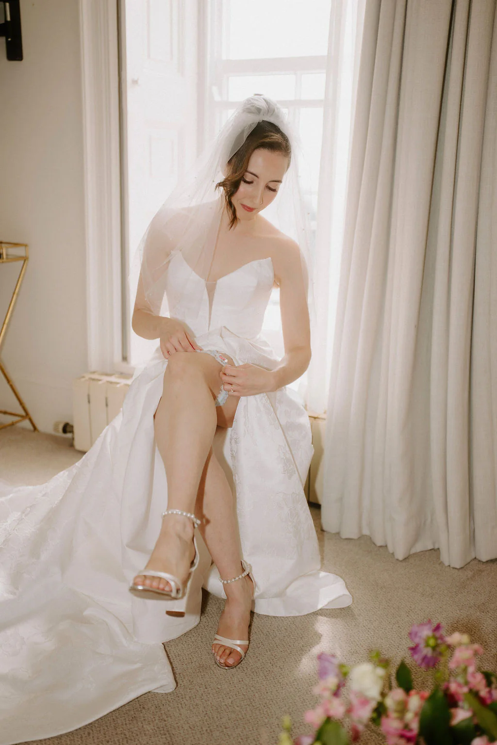 Louisa | Bridal Gown Details Louisa in her wedding dress holding a soft bouquet of white roses and greenery at New House Country Hotel