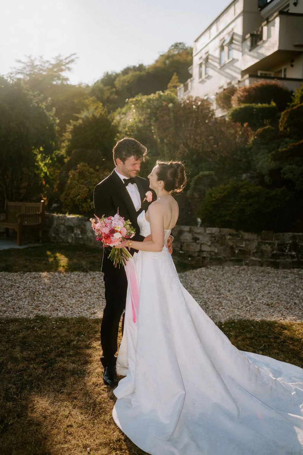 Louisa and Chris smiling during their golden hour couple walk at New House Country Hotel