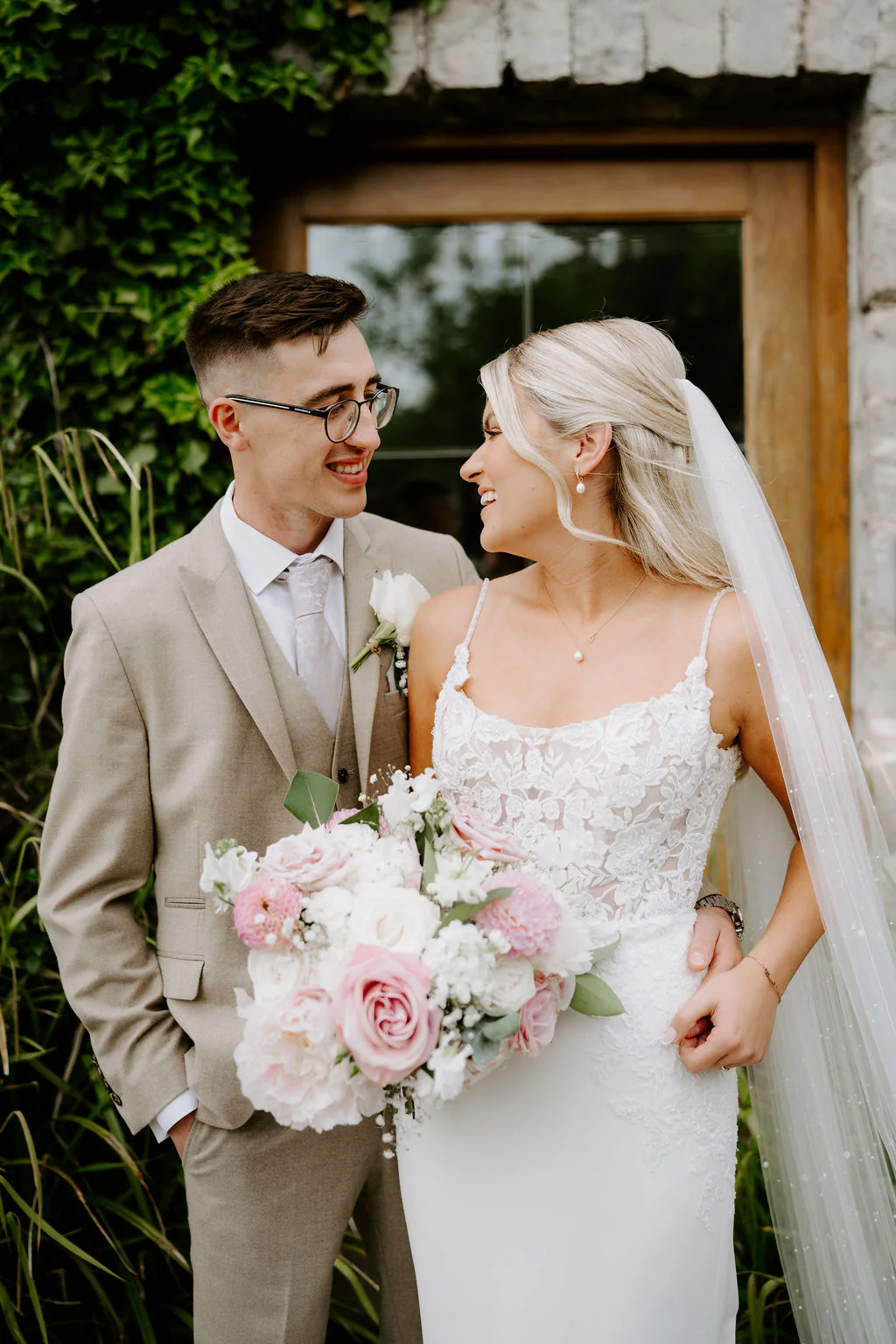 Morgan and Kate relaxed wedding portrait in the fields at Rosedew Farm in Llantwit Major