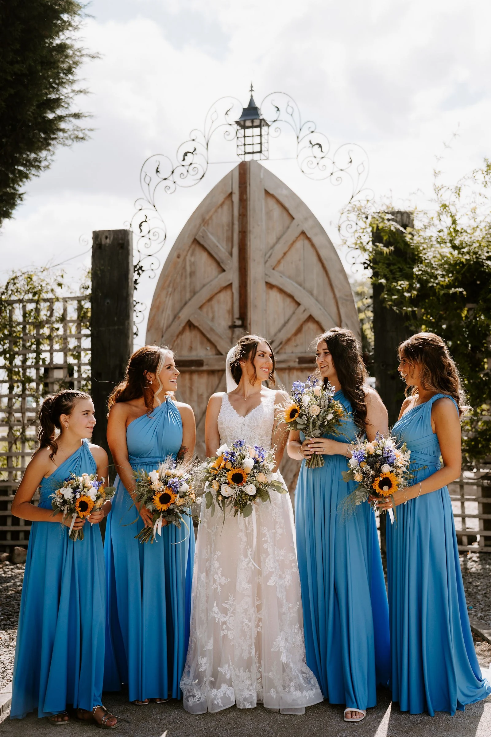 Martha and her bridesmaids outside the White House at Alcumlow Wedding Barn