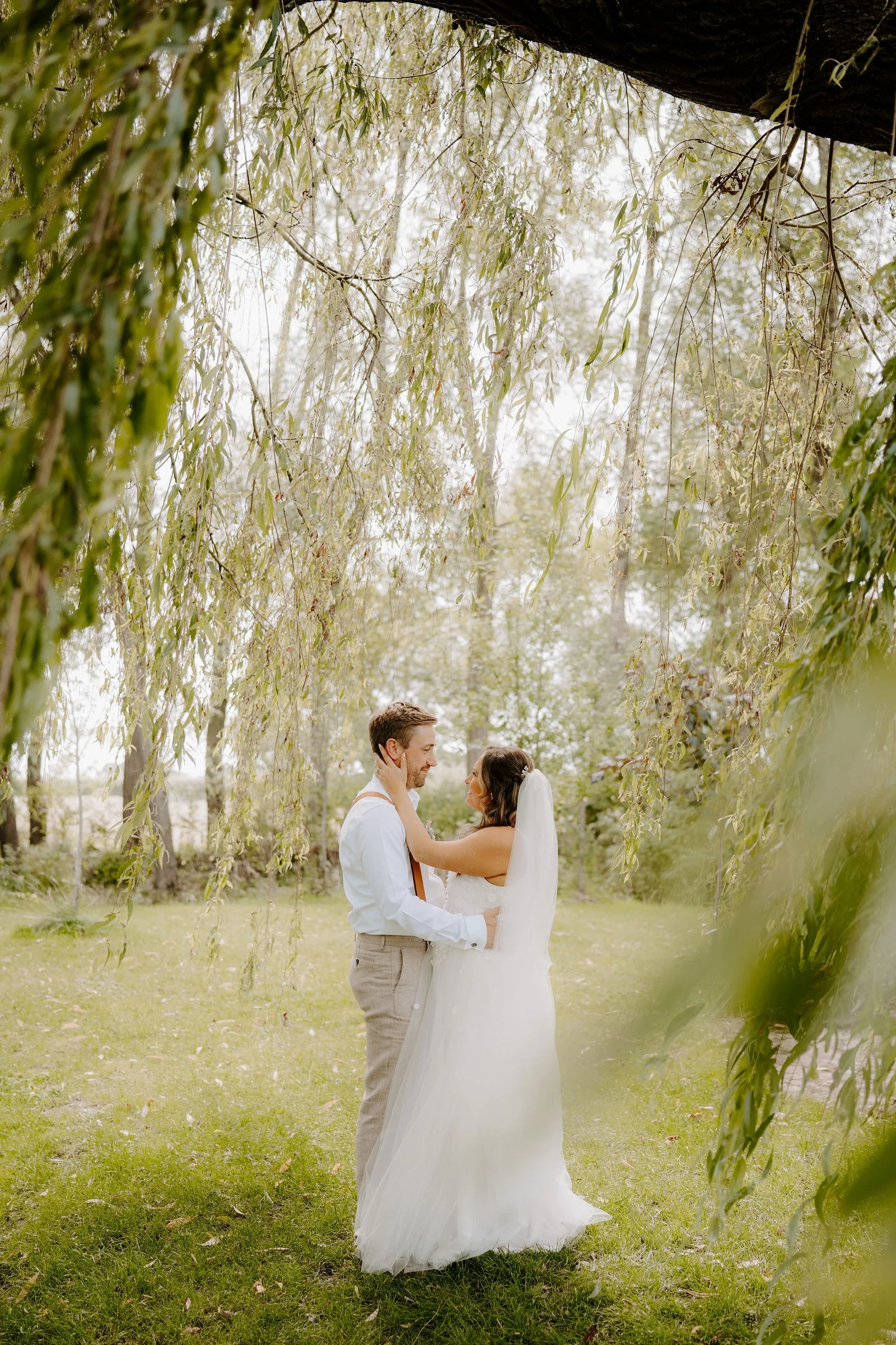 Rebecca and Sam sharing a quiet moment beneath a willow tree at Duddon Mill Farm