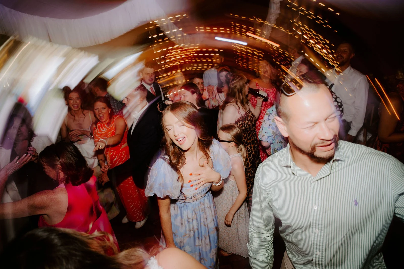 Rebecca and Sam celebrating on the dance floor with their guests at Duddon Mill Farm