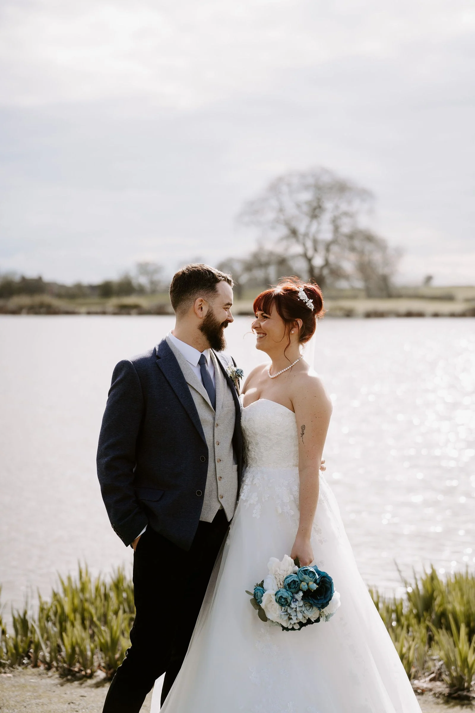Andy and Paula together beside the lake at Sandhole Oak Barn