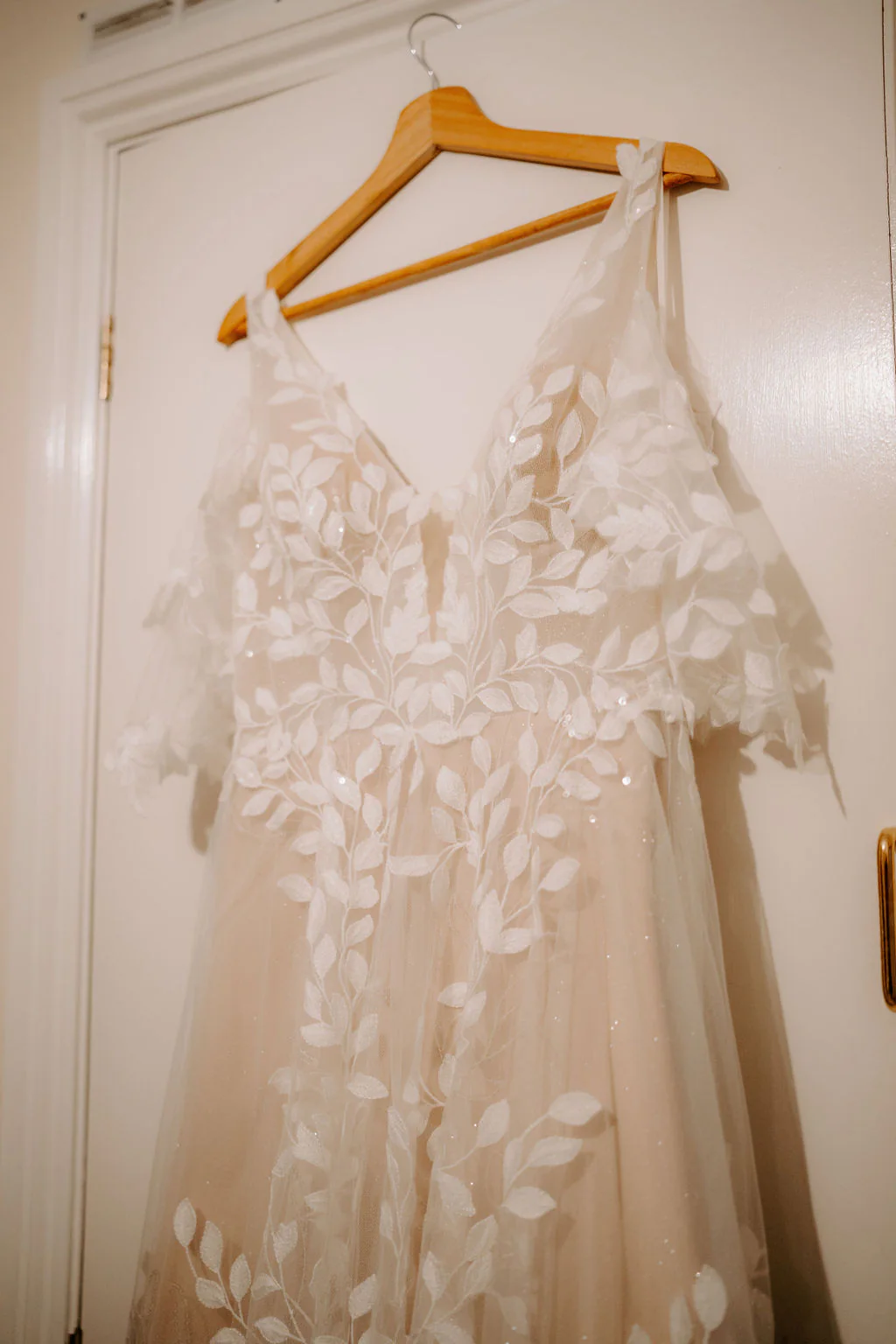 Bridal gown hanging in soft morning light at The Matara Centre