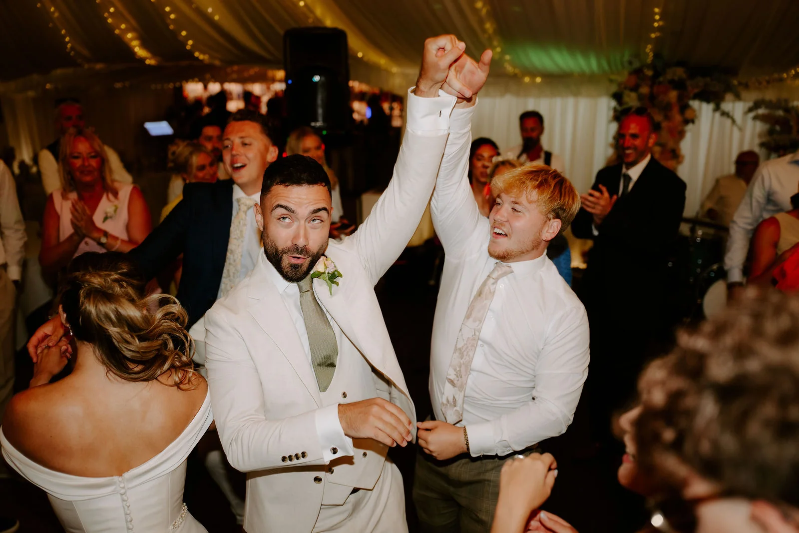 Guests celebrating on the dance floor in the marquee at Parley Manor