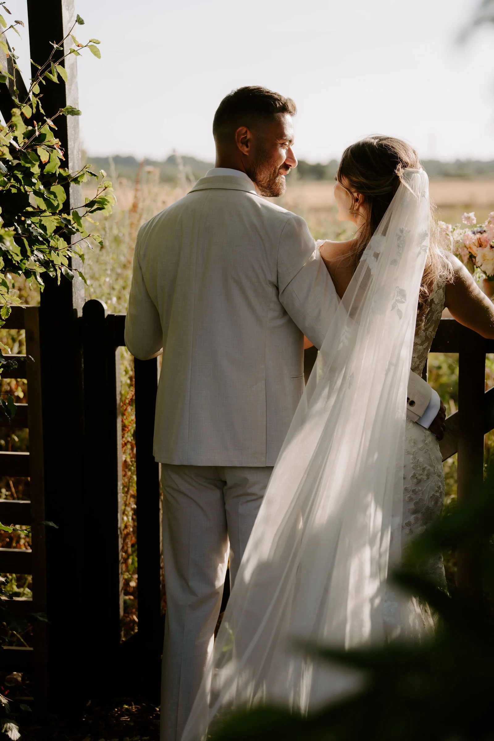 Faye and Sam together among the garden greenery at Parley Manor