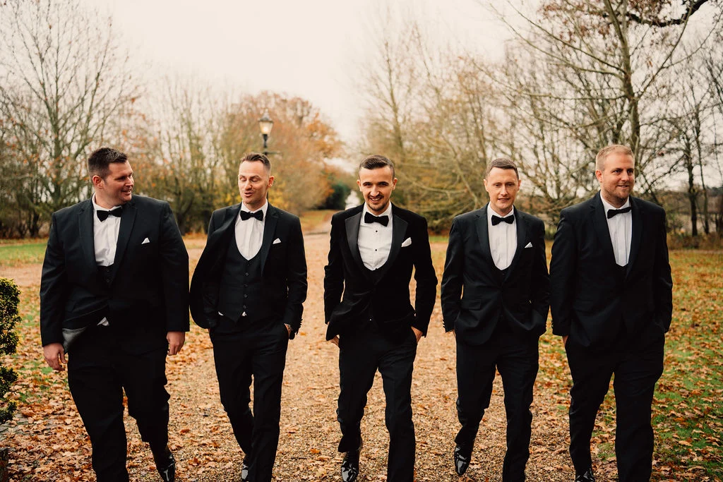 Michael with his friends outside at their winter wedding at Villiers Barn