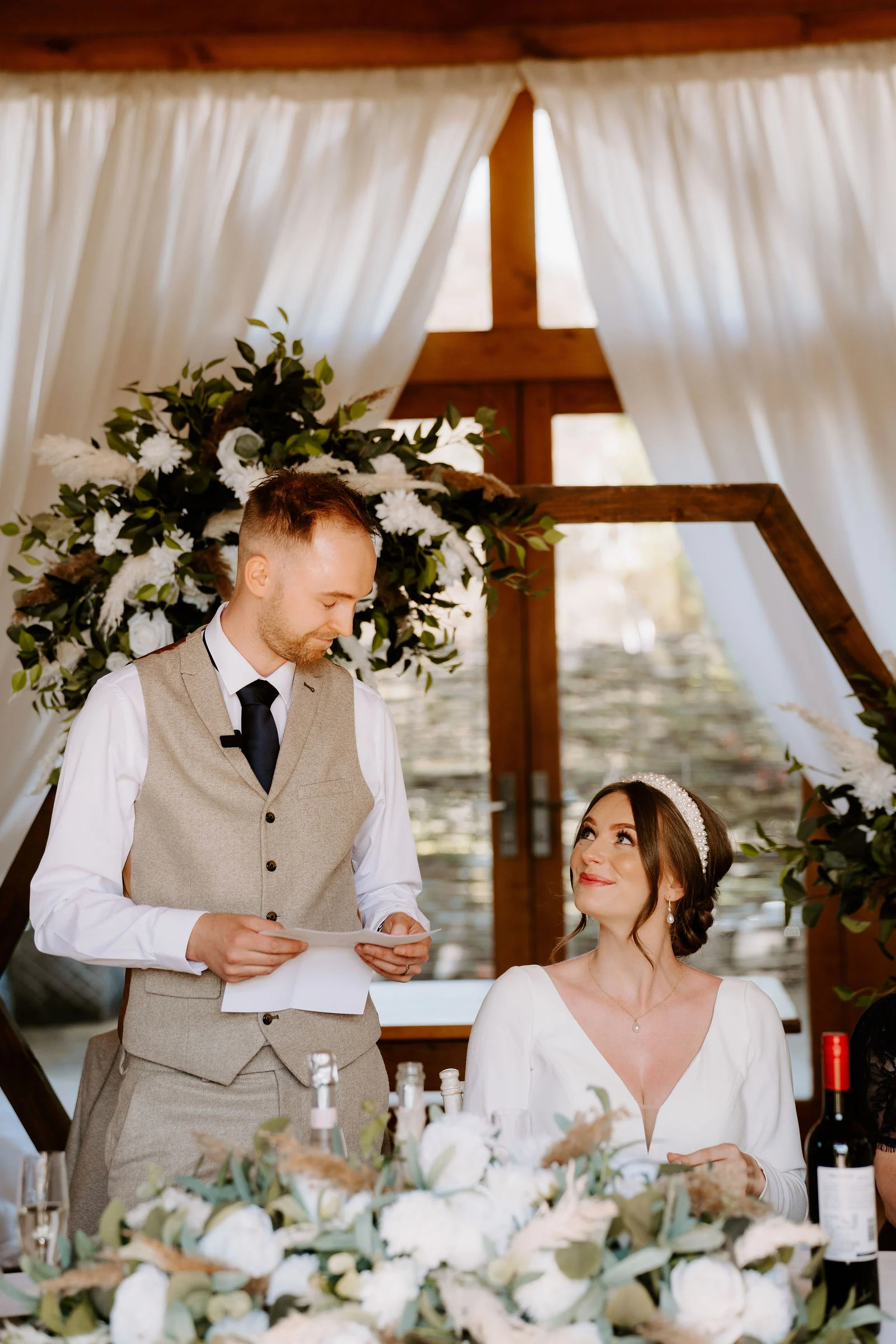 Natural smiles and candid laughter in the courtyard at The Barn at Upcote