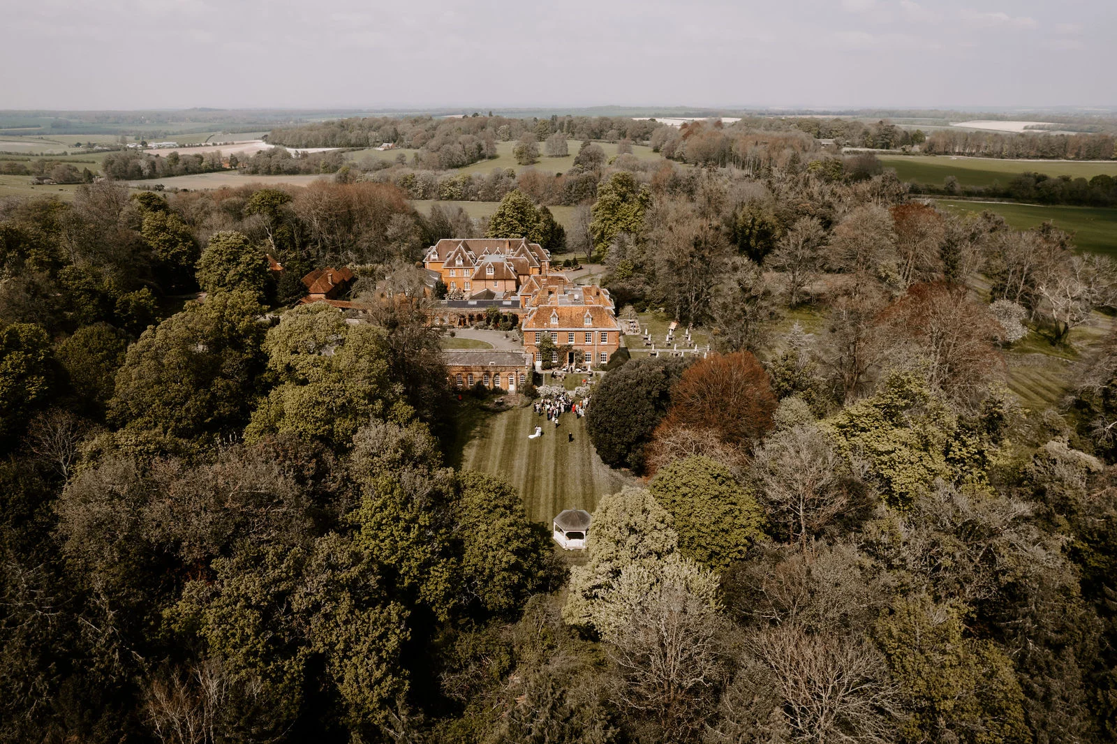Aerial view of Lainston House and its wooded Hampshire grounds