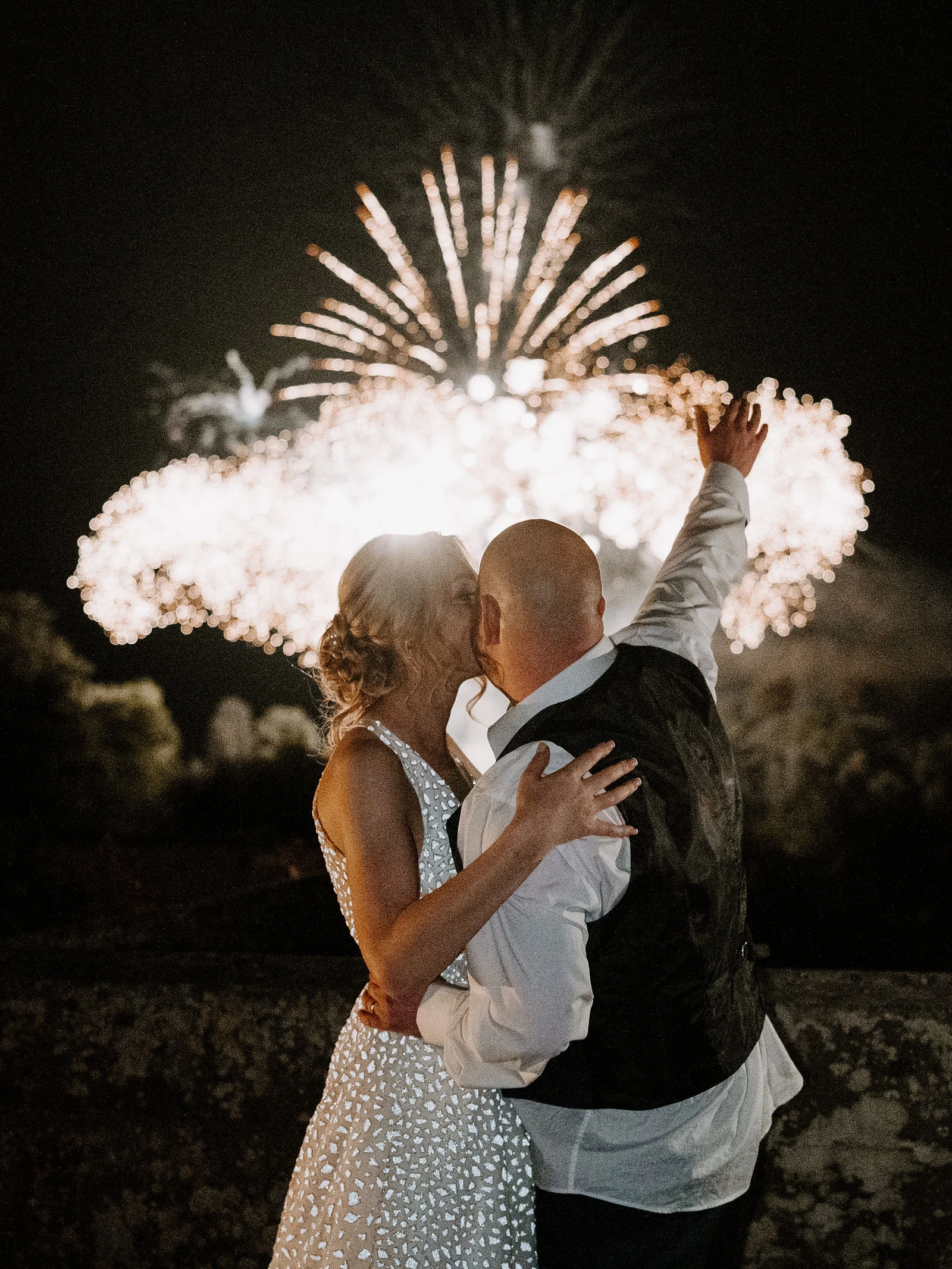 Evening couple portrait against the stone ramparts of Eastnor Castle