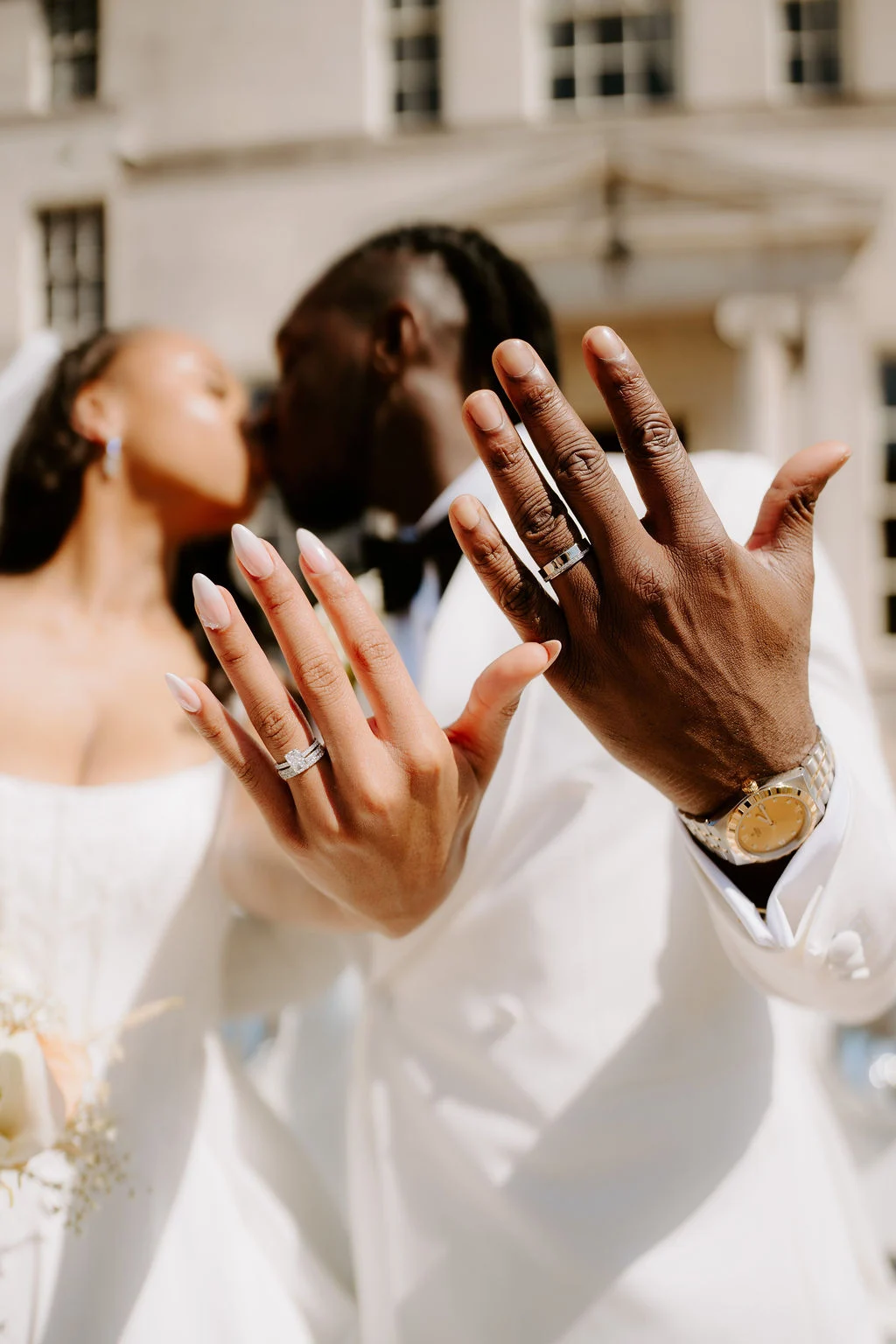 Tobenna and Sapphire showing their wedding rings.
