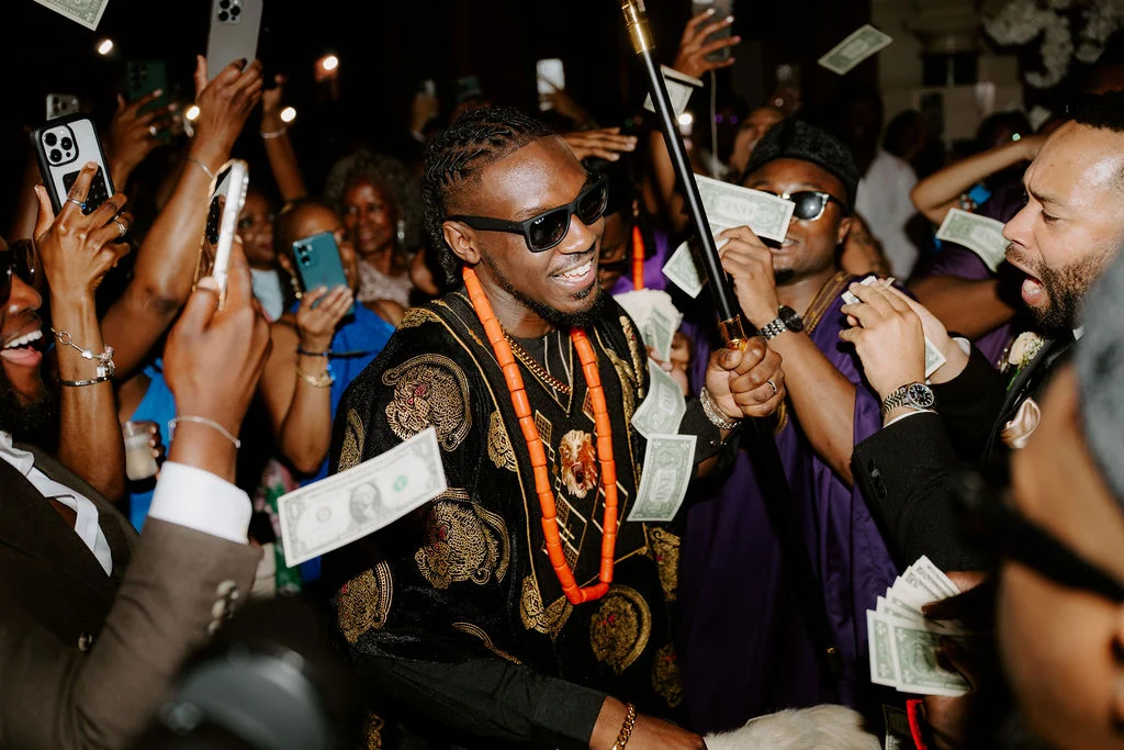 Tobenna and guests celebrating on the evening dance floor.