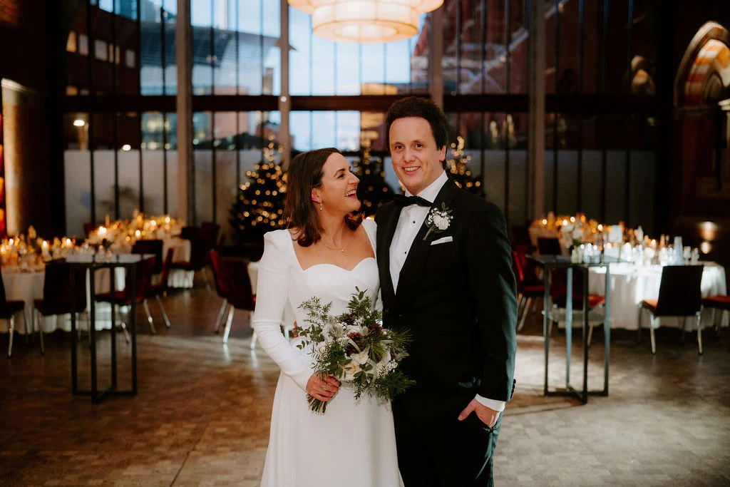 Jo and Sam together at their reception tables.