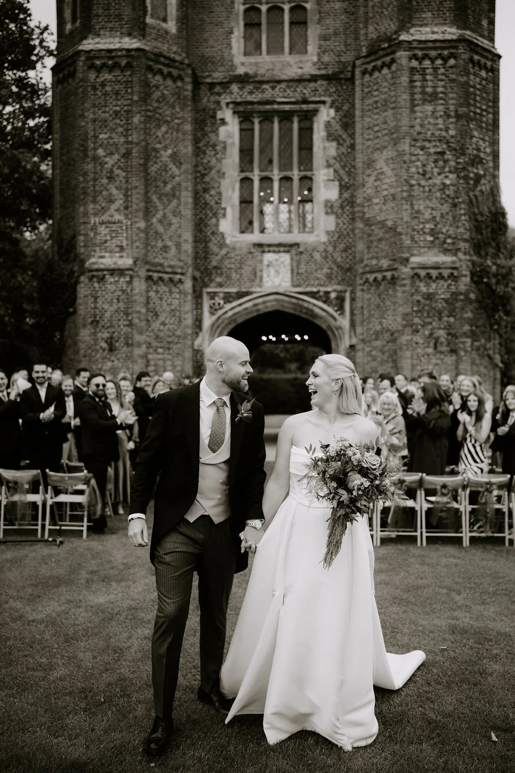 Black and white portrait of Sophie and Jake outside the tower.