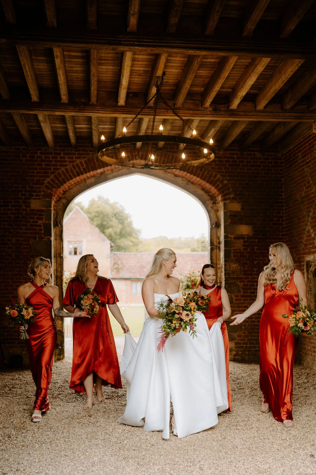 Sophie arriving beneath the timber-framed archway.