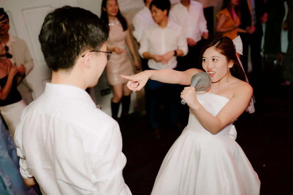 Jonathan and Tasha dancing together with guests around them.