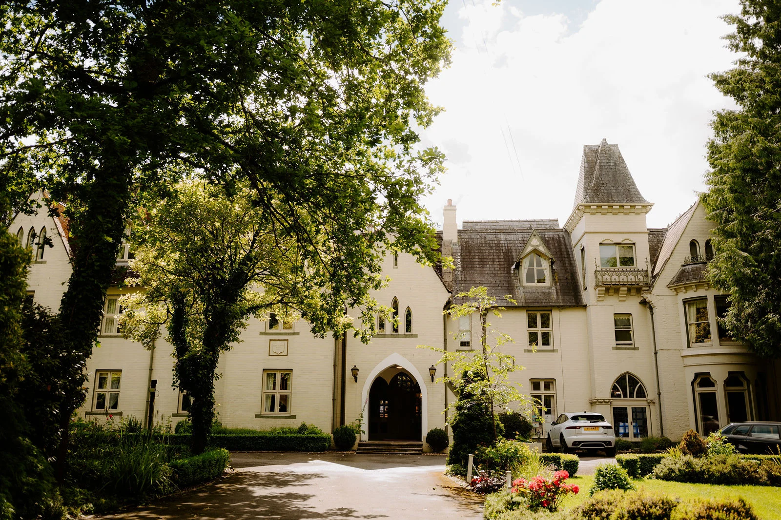 Glen-yr-Afon House Hotel framed by mature trees in Usk, Monmouthshire