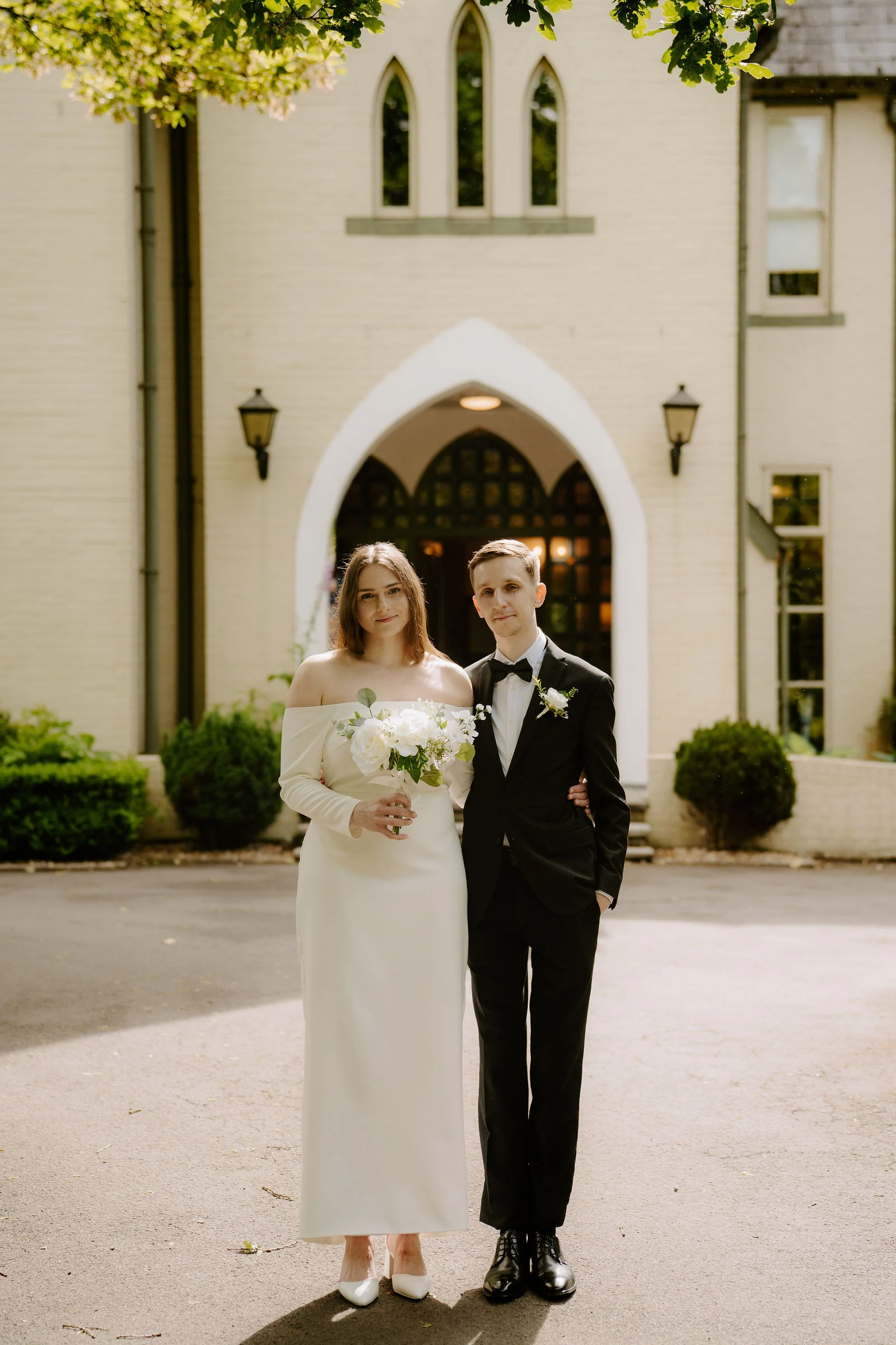 Agata and Matt standing outside the entrance to Glen-yr-Afon House Hotel