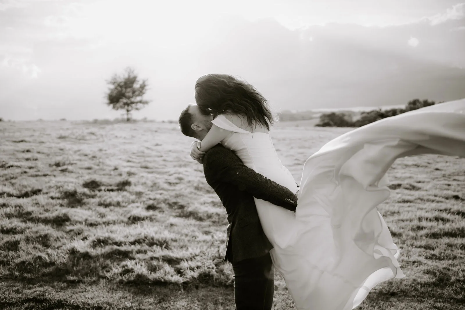 Charlie and Faye celebrating their ceremony vows inside the Mortain Barn at Dodford Manor