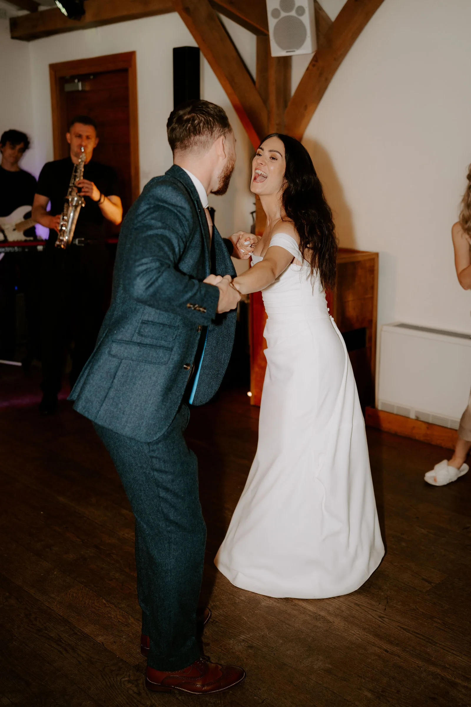 Charlie and Faye sharing an unhurried embrace during golden hour at Dodford Manor