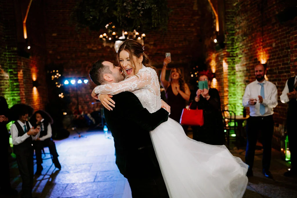 Martin spinning Hayley during their first dance beneath fairy lights