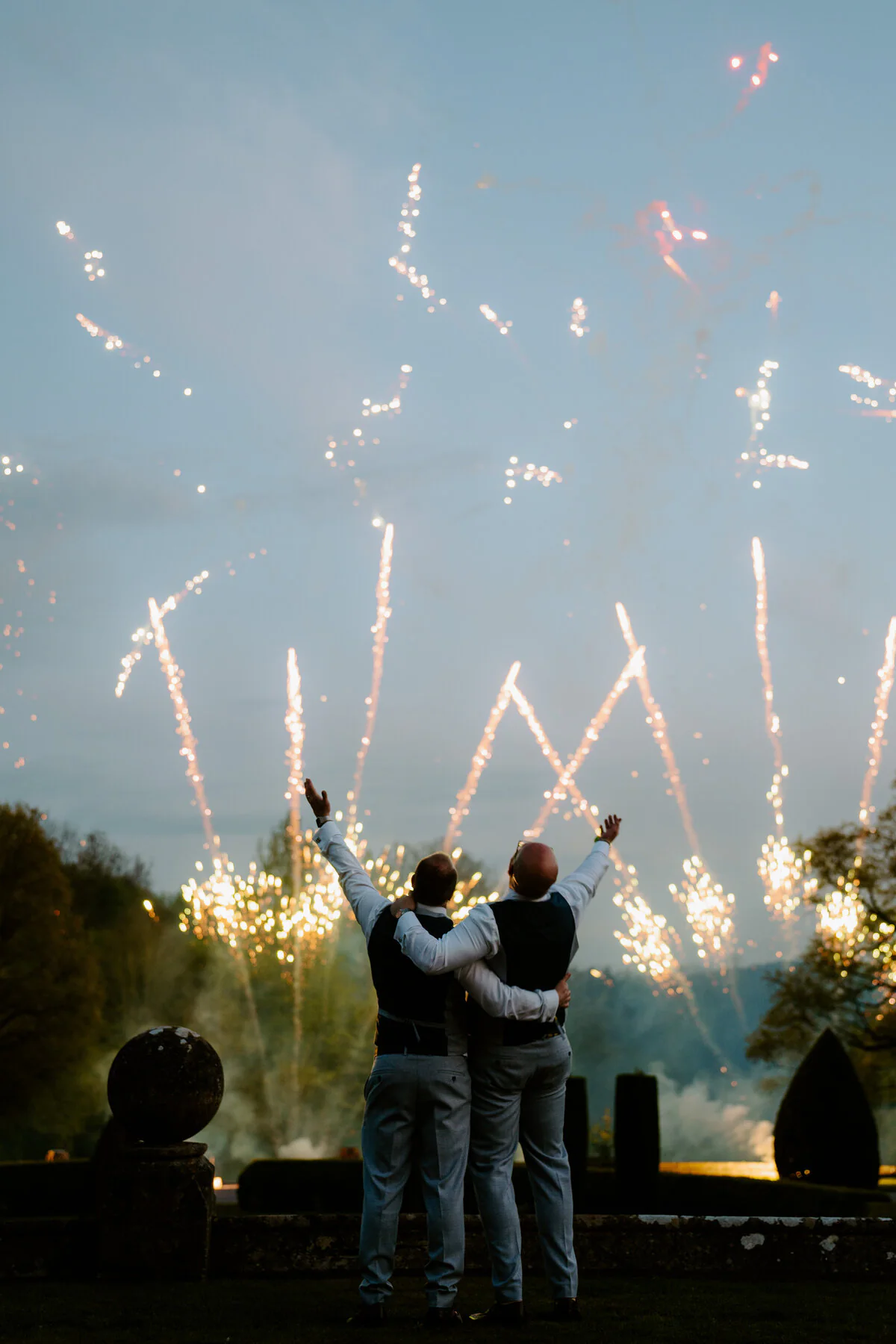 Wedding fireworks lighting the night sky during a Cardiff wedding celebration.