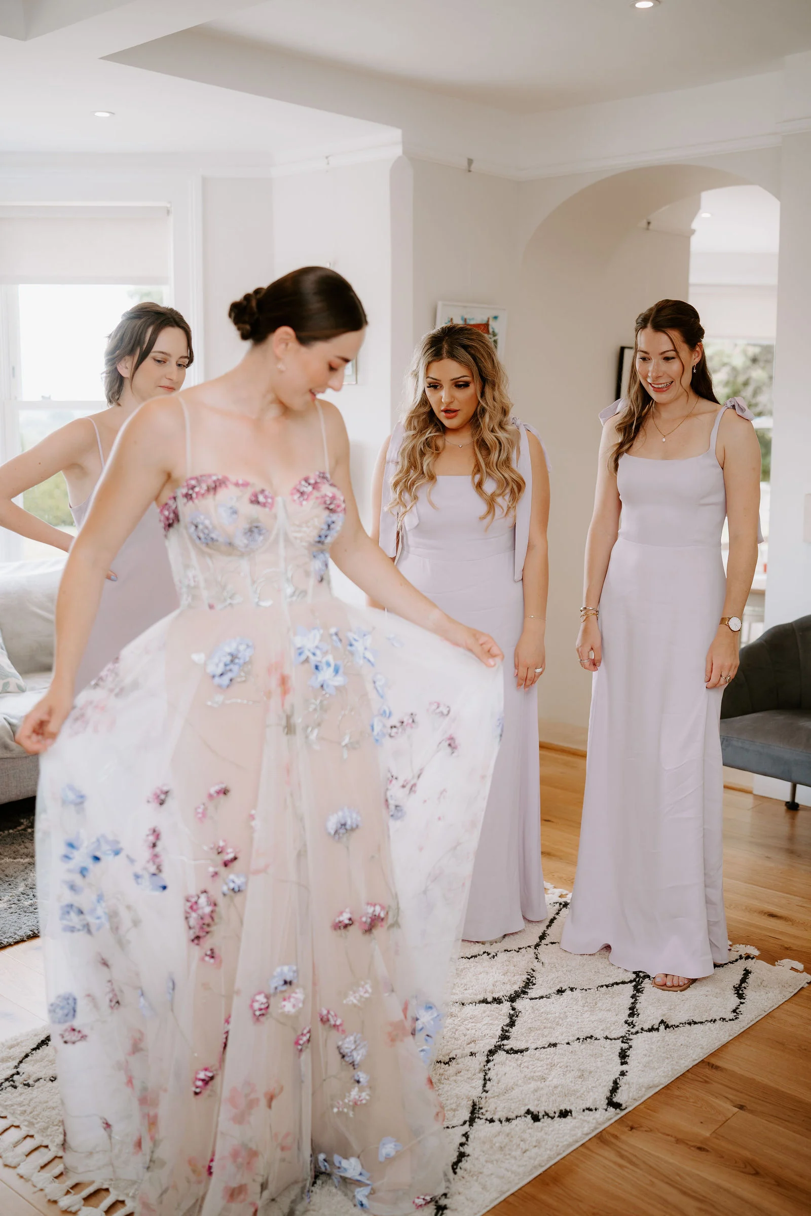 Eden smiling warmly in her bespoke wedding dress at Le Manoir aux Quat'Saisons