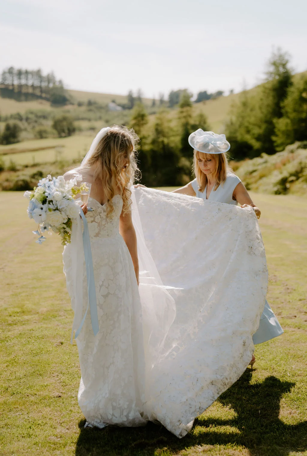 Ella with her bridesmaids in an open meadow