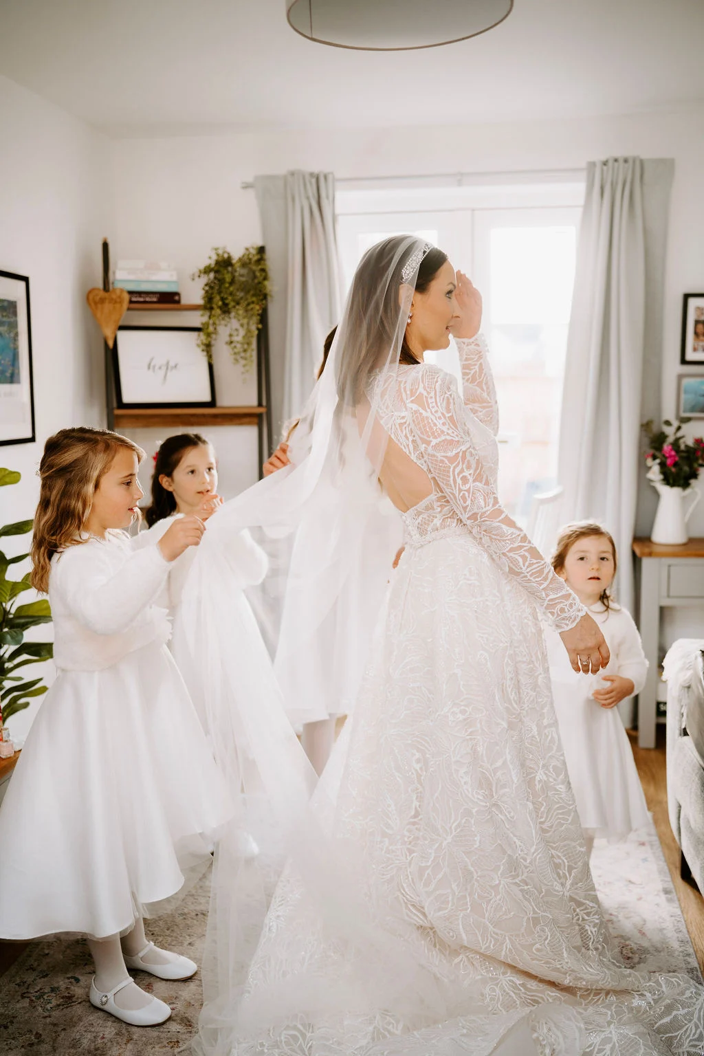 Ruth in her wedding dress with children beside her during preparations