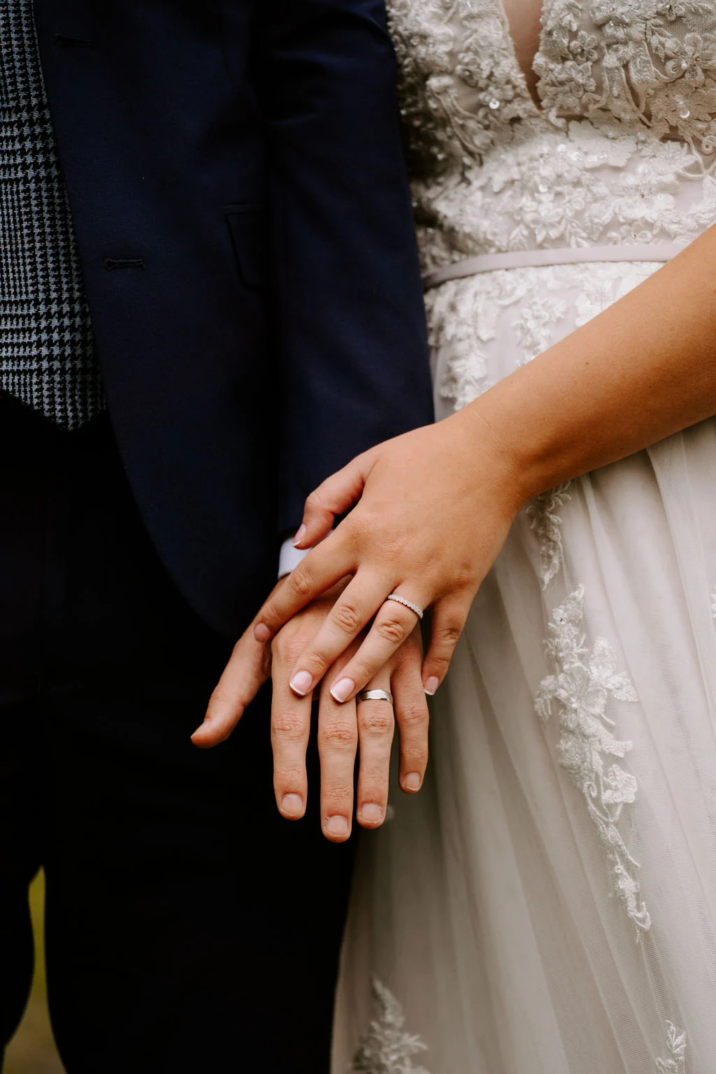 Close view of Analise and Mcauly’s hands and wedding rings