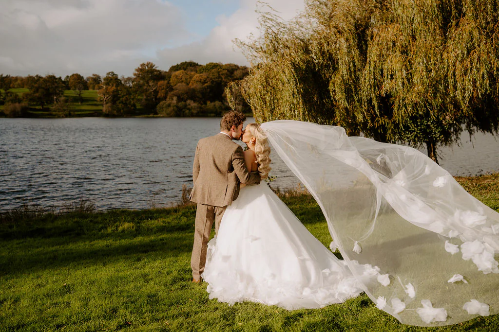 Nikita & Nathan couple portrait in front of the historic walled gardens and glasshouse at Combermere Abbey