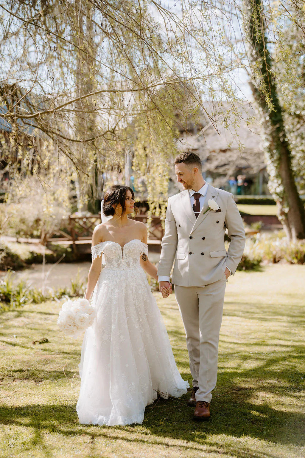 Sian & Tim confetti exit outside the oak barn at The Mill Barns