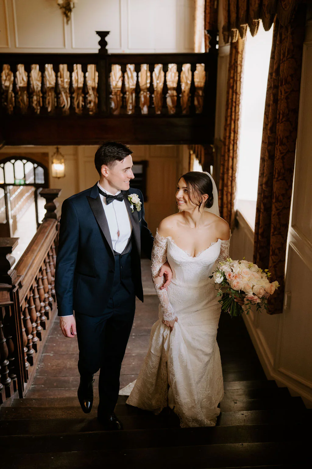 Evening dinner reception and laughter inside the medieval Castle House at Brympton House in Yeovil