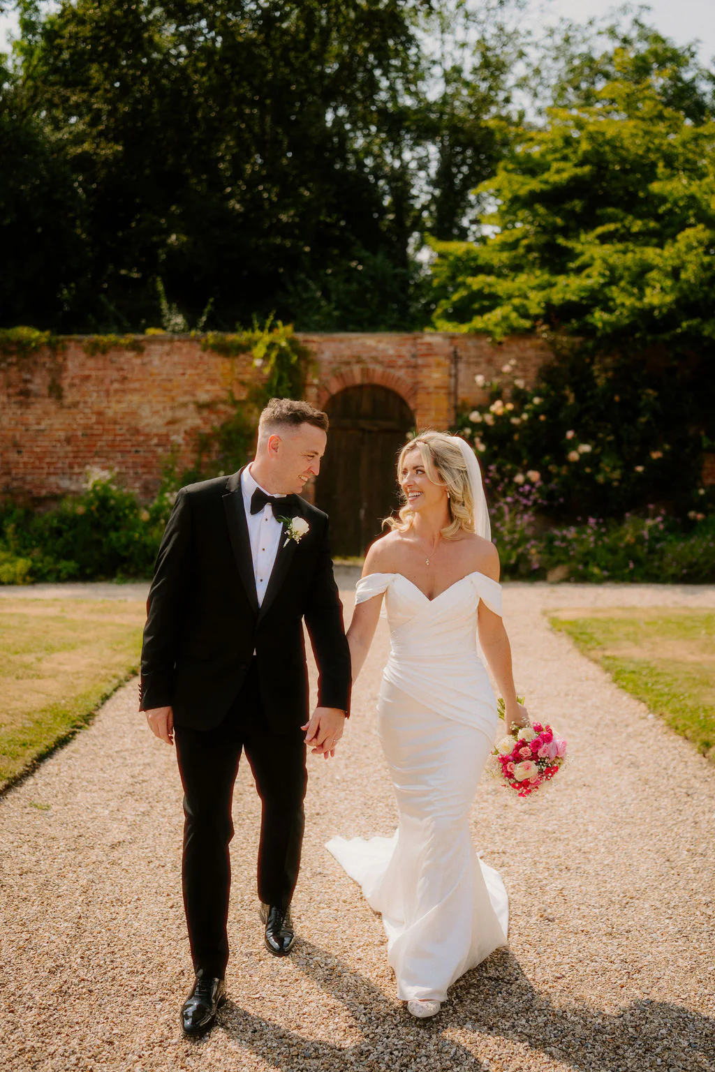 Outdoor drinks reception and guest mingling in the walled gardens at Elmhay Park near Frome