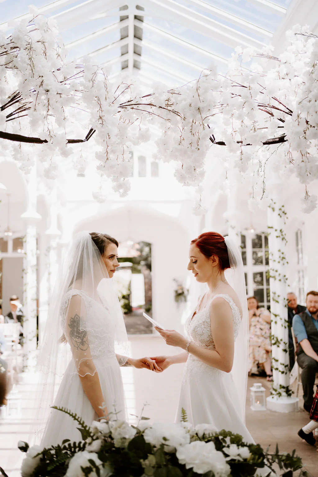 Jodie & Natalie wedding vows in the light-filled Victorian Orangery at St Audries Park near Taunton