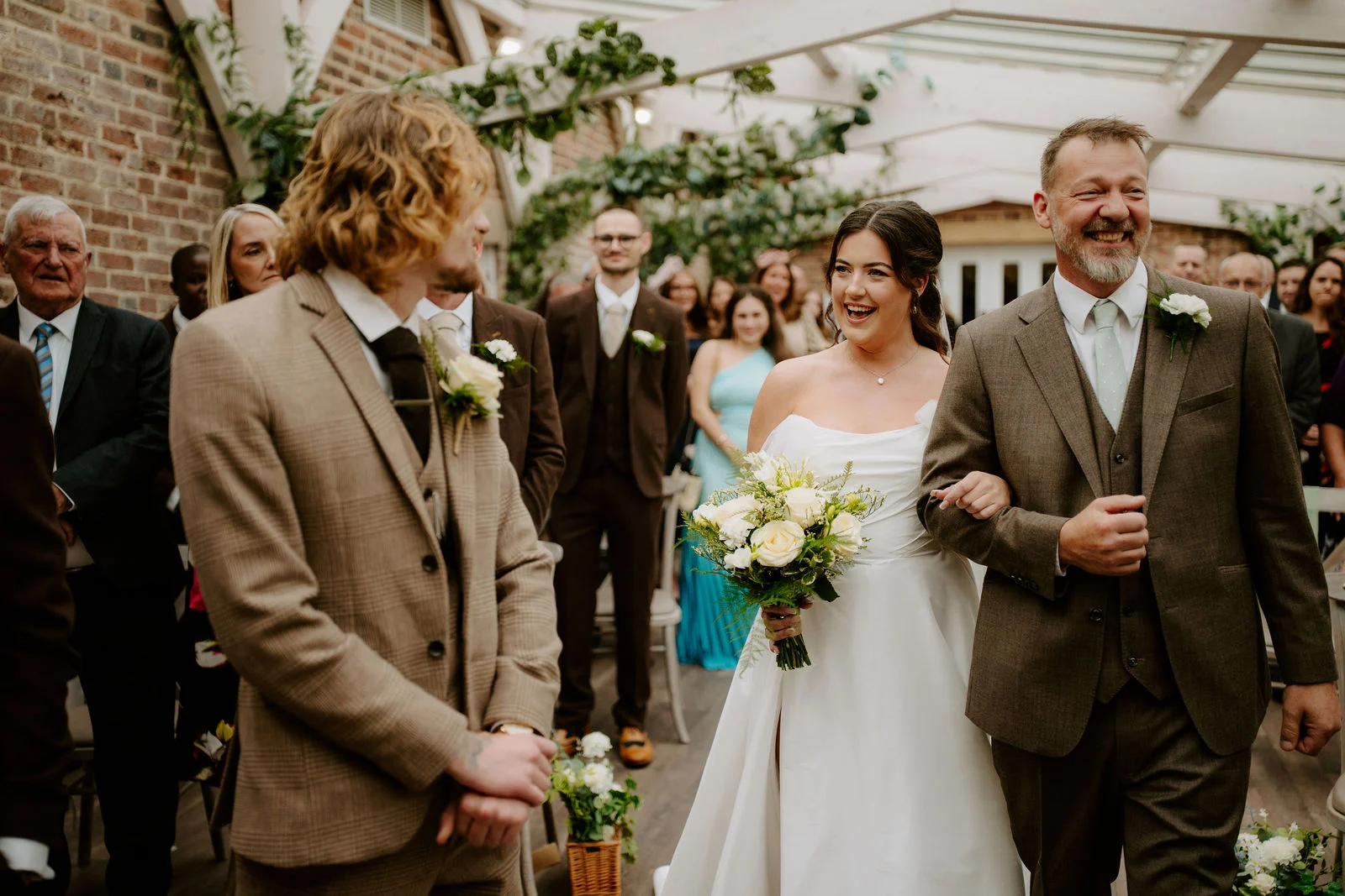Jenny arriving for the ceremony as Conan turns towards her at Foxtail Barns