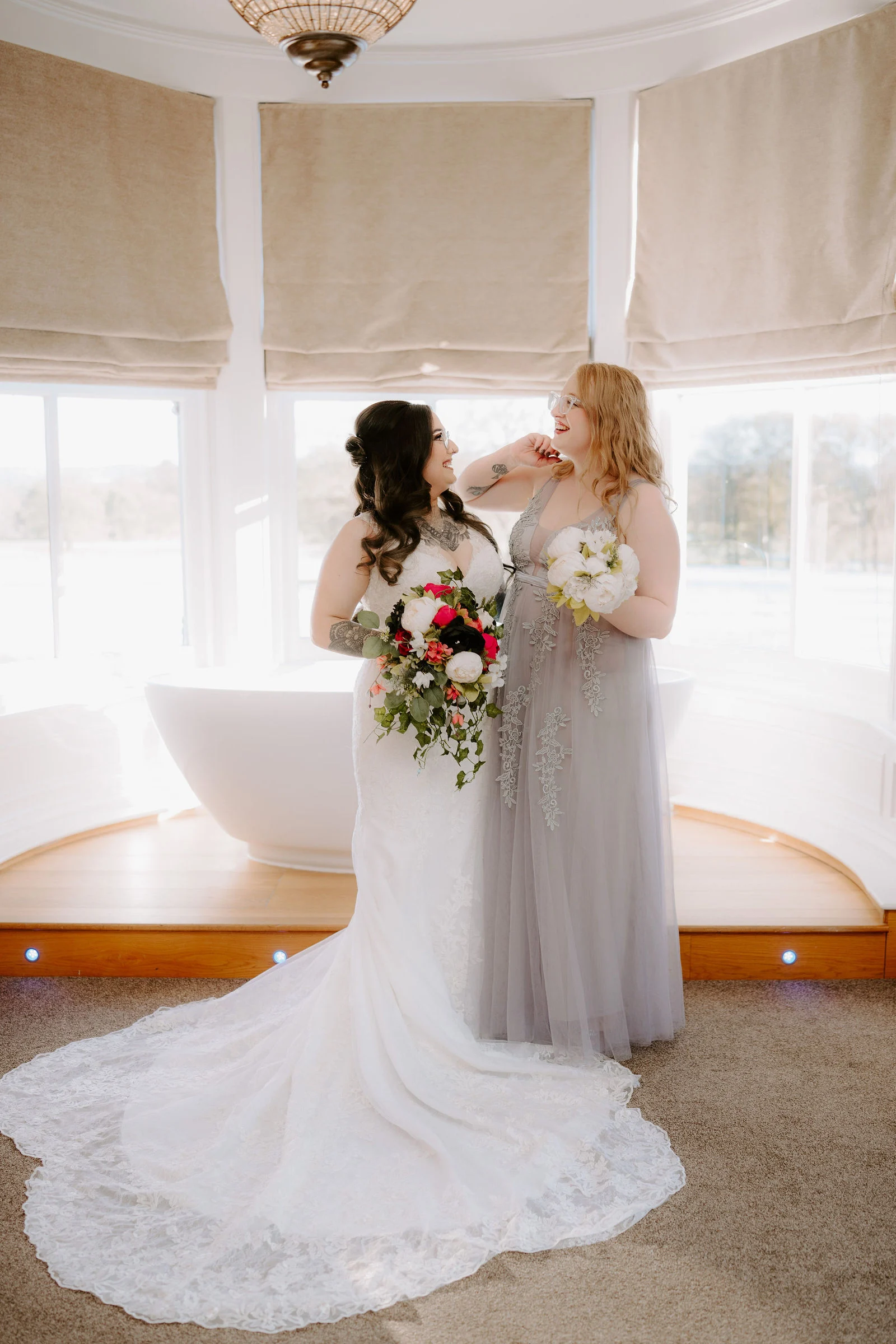 Farha sharing a smile with a member of her wedding party during preparations at Pendrell Hall