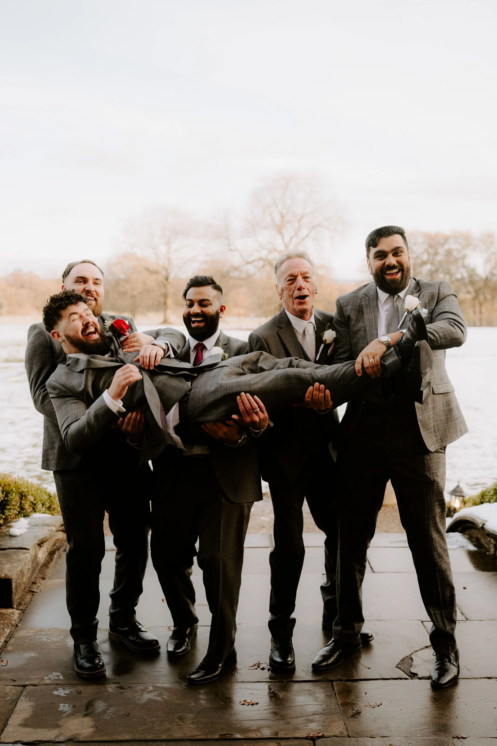 Alex and friends laughing together during group photographs at Pendrell Hall