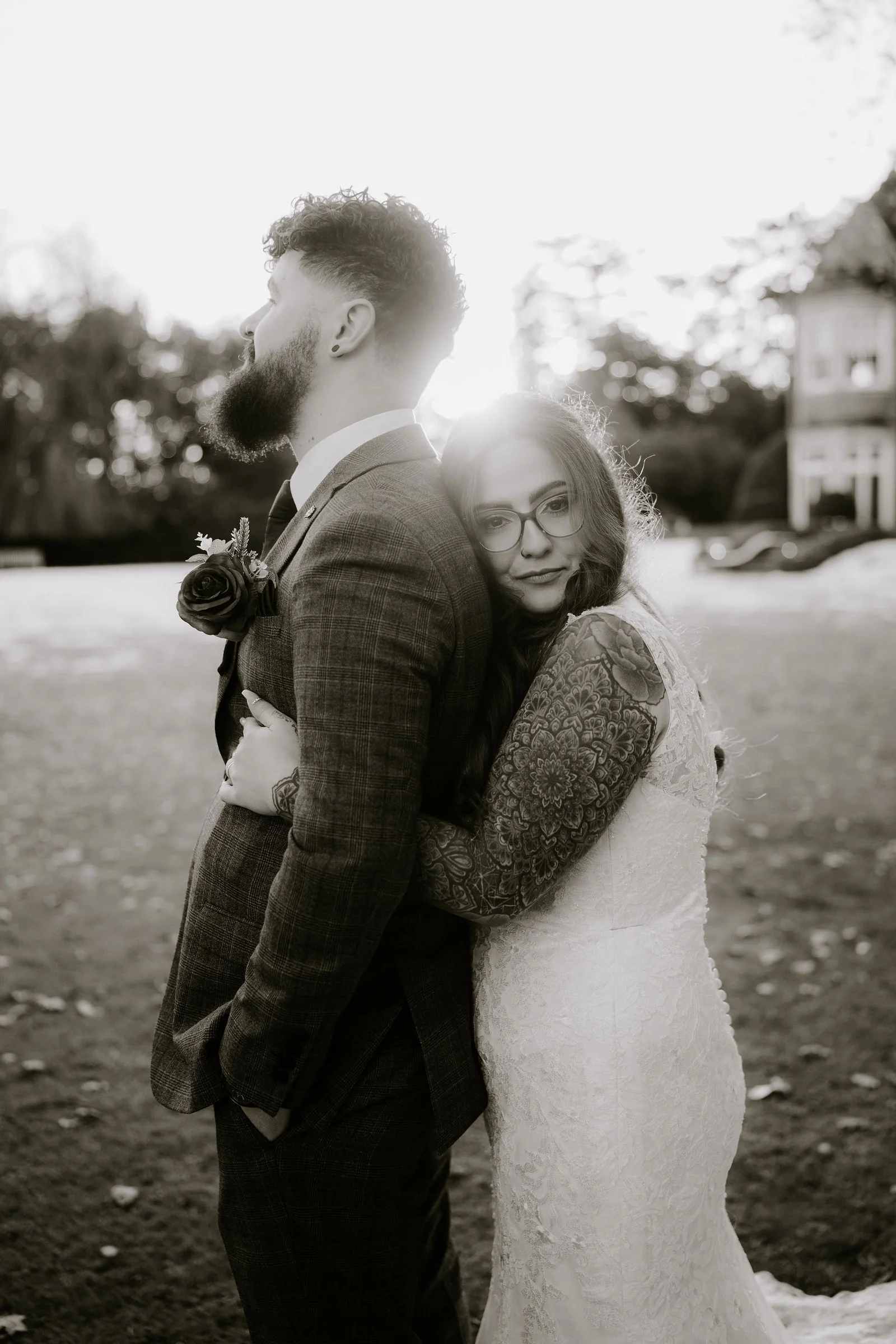 Farha resting her head against Alex during a black and white portrait at Pendrell Hall