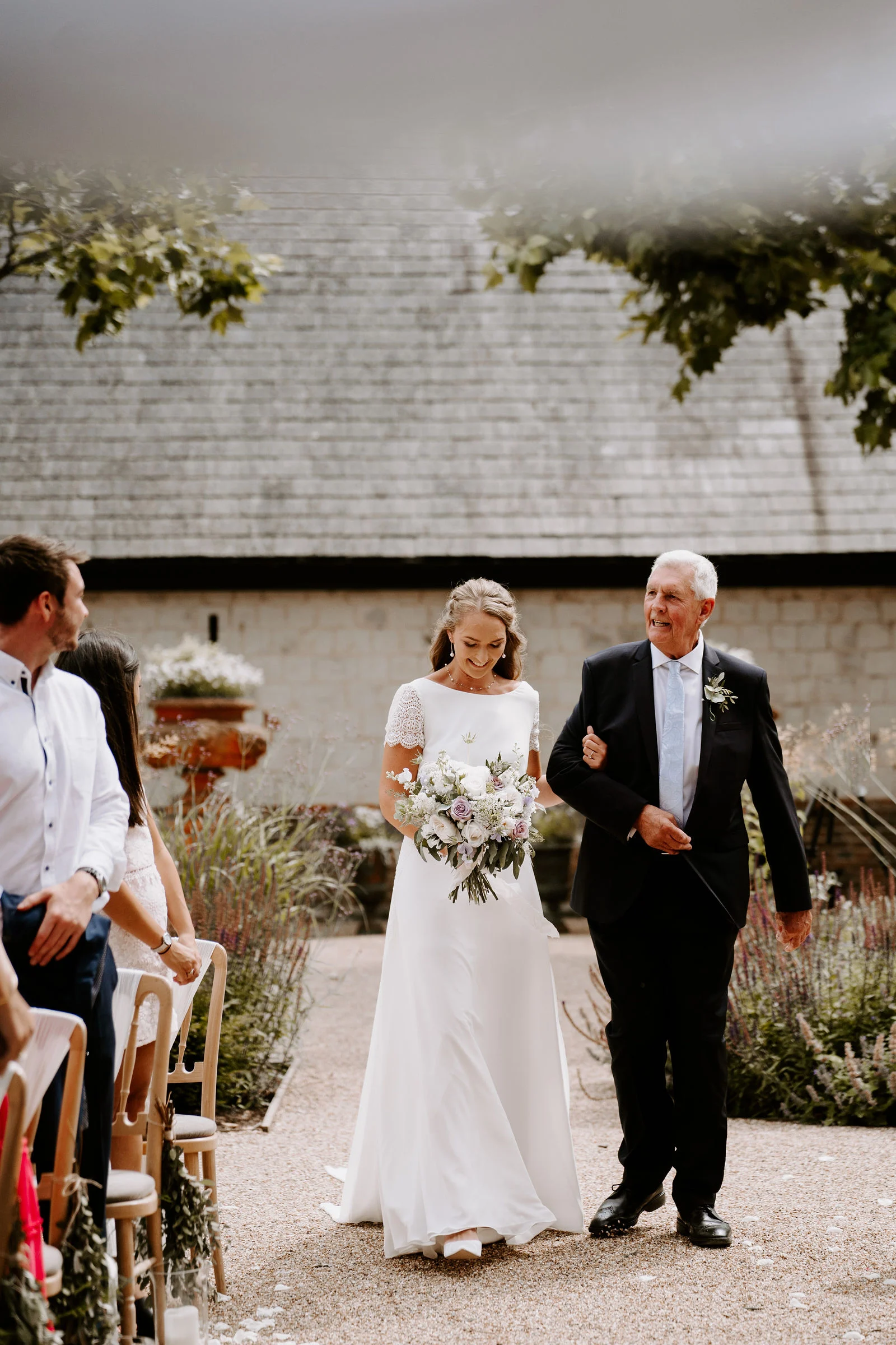 Outdoor ceremony in the walled garden at The Barn at Bury Court on the Surrey and Hampshire border
